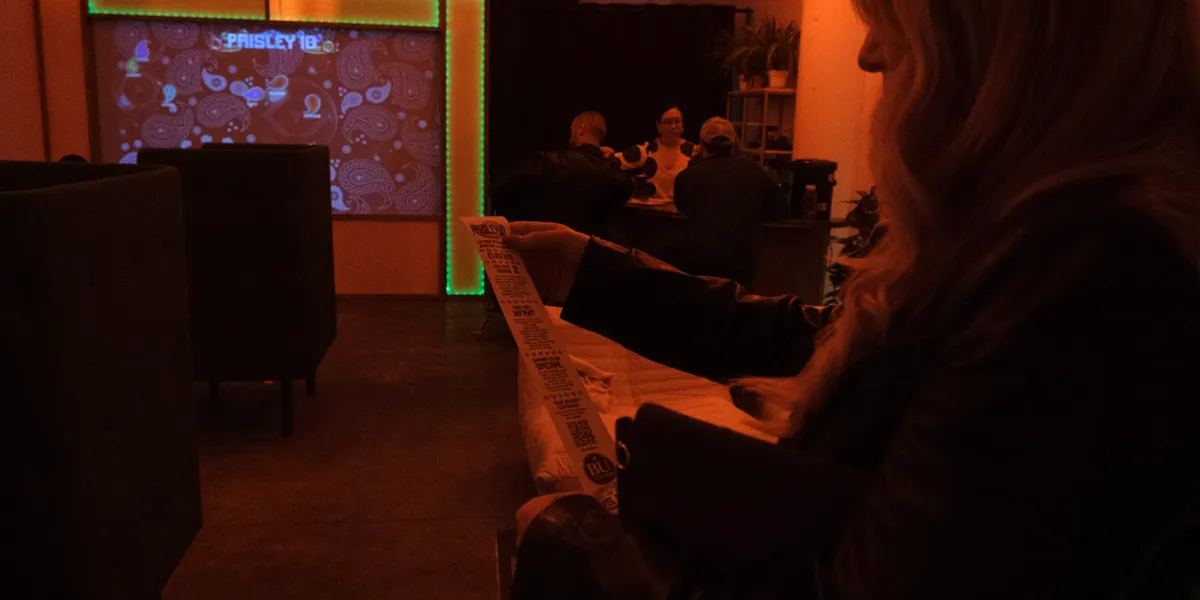 Guests in the Den watching the Paisley ID projection wall