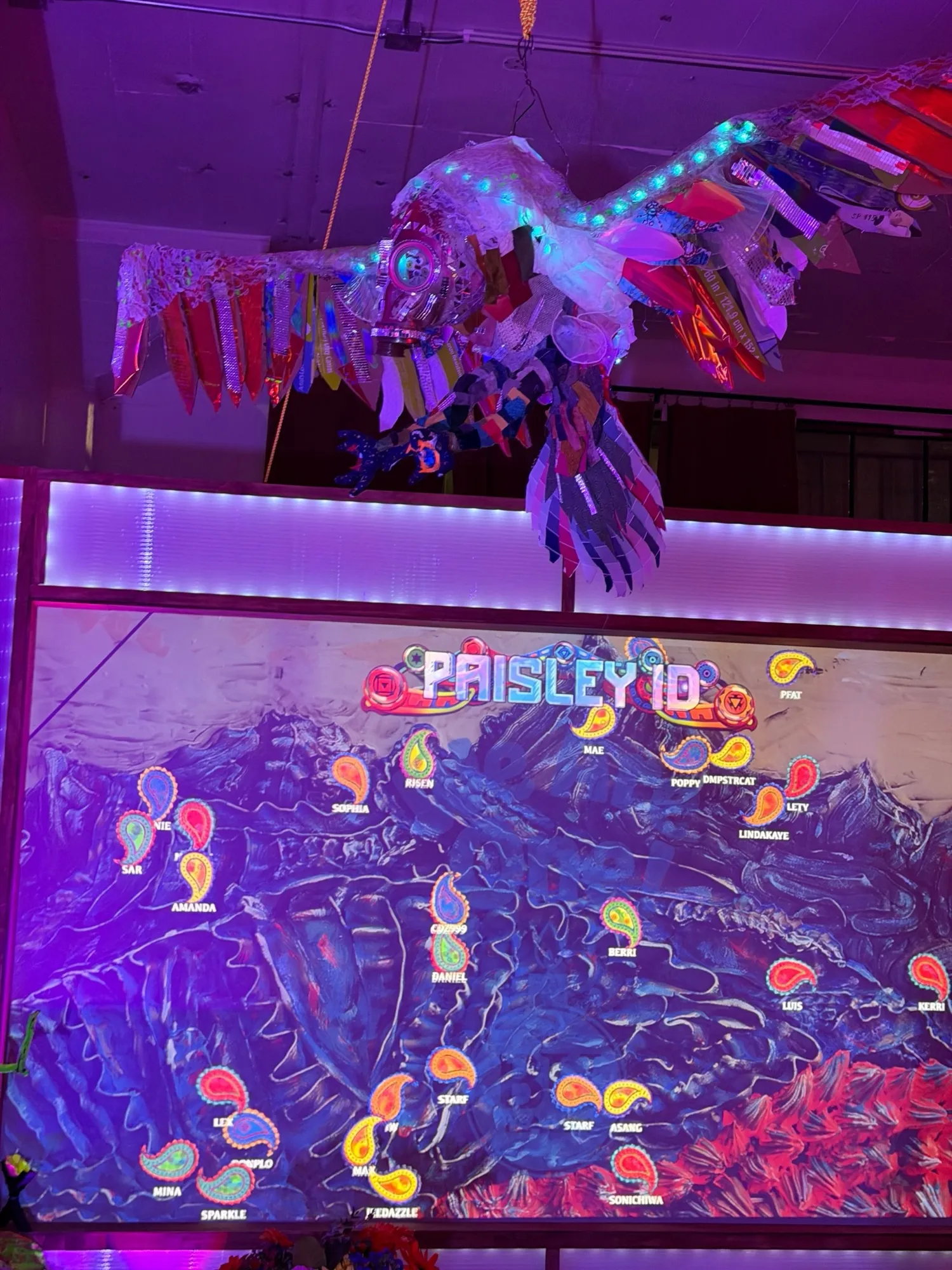 The aquarium wall with dozens of guest Paisleys, each labeled with a name