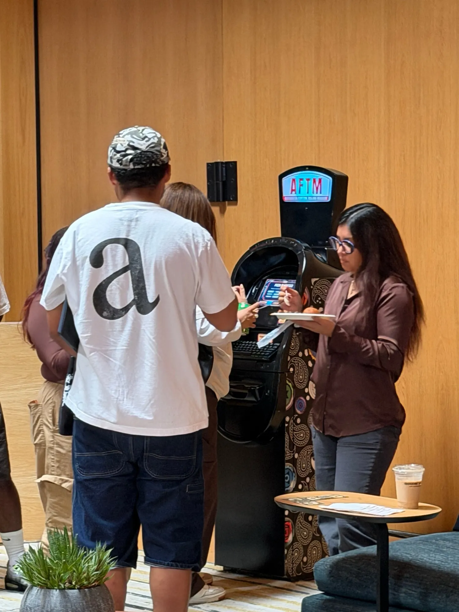 Guests gathered around an AFTM at a corporate event
